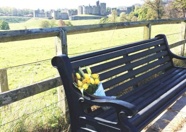Brizlee WI placed their bouquet overlooking the river Aln and Alnwick Castle to celebrate National Flower Day