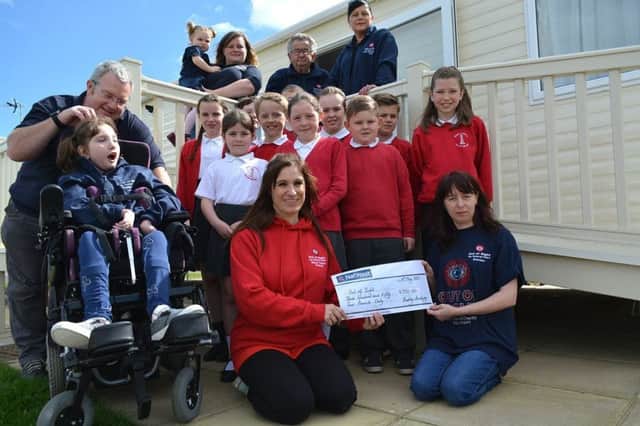 Redby Primary Academy pupils raised money for the upkeep of Amble-based Chloe's Den, which was purchased thanks to a fund-raising campaign by the Out of Sight charity.