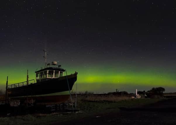 The Northern Lights seen at  Holy Island. Picture by Jane Coltman