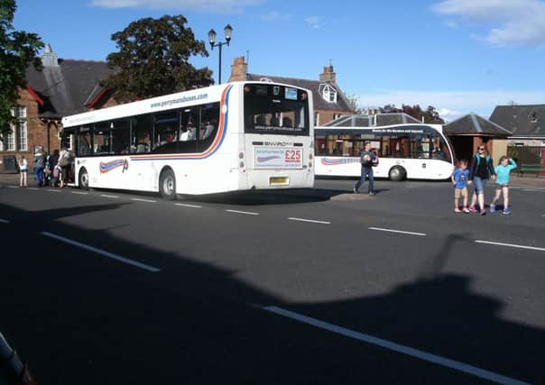 Interchange between buses at a meeting point in the Scottish Borders.  The pattern of connections involves four routes and takes two forms, each of which happens reliably every two hours.