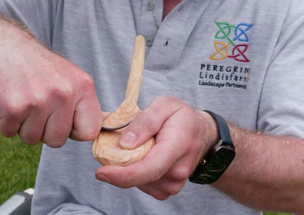 Mark Johnstone tries his hand at ancient wood craft at the Peregrini Lindisfarne Heritage Festival. Picture by Dave Foster.