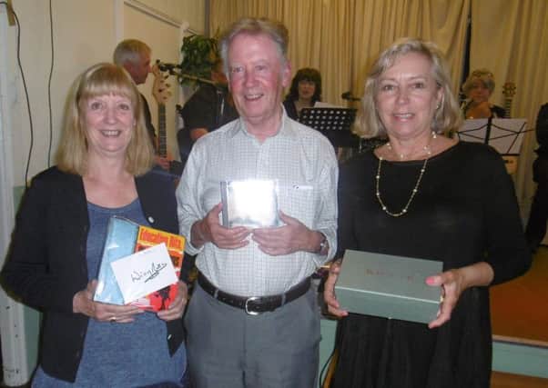 Raffle winners at the St Mary's Church fund-raising event in Lesbury Village Hall. Picture by Colin Platt.