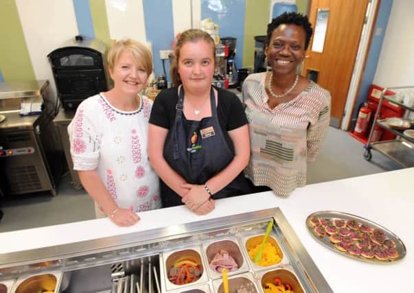 The Opportunity Cafe in Newburn has opened its doors for the first time  and is run by adults and young people with learning disabilities.

L-R: Judith Thompson, network manager for the North East and Cumbria Learning Disability Network, worker Amy Conway from Felton, and Lela Kogbara, Director of Employment Programmes for NHS England