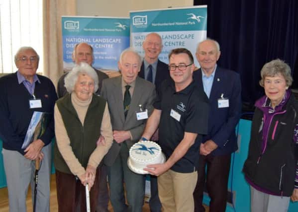 Volunteers celebrate their long service achievement with Tony Gates, chief executive of Northumberland National Park Authority.