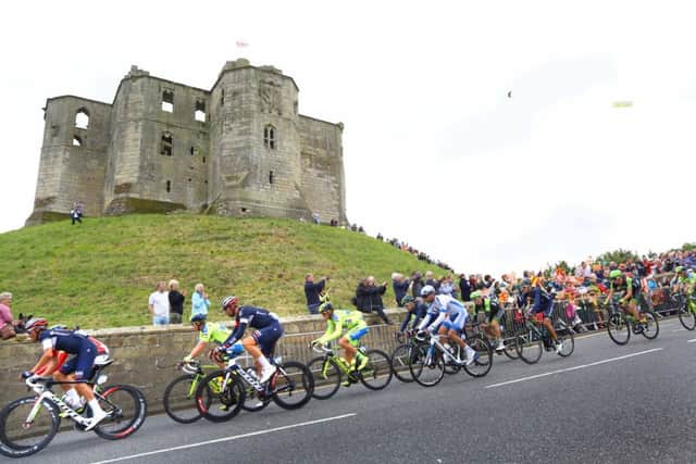 The Tour of Britain passing Warkworth Castle in 2015. Picture by Simon Williams of Crest Photography.
