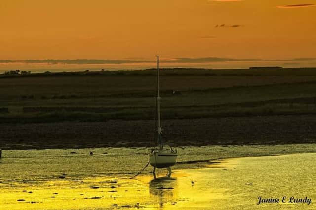 Low tide at Lindisfarne by Janine Lundy.