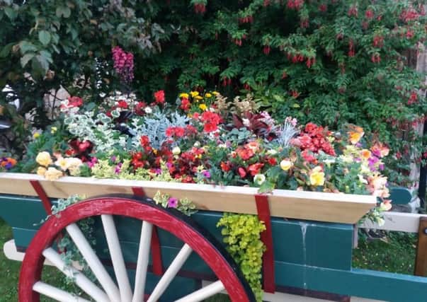 The beautifully planted new cart at The Coach Inn in Lesbury makes sure everyone is smiling again. Picture by Tom Pattinson.