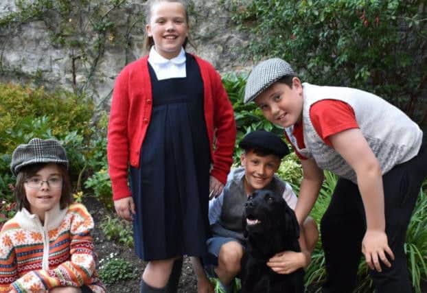 Youngsters Archie Braid, Niamh Cullen, Cameron Cullen and Aidan Stuart with Lenny the Labrador.