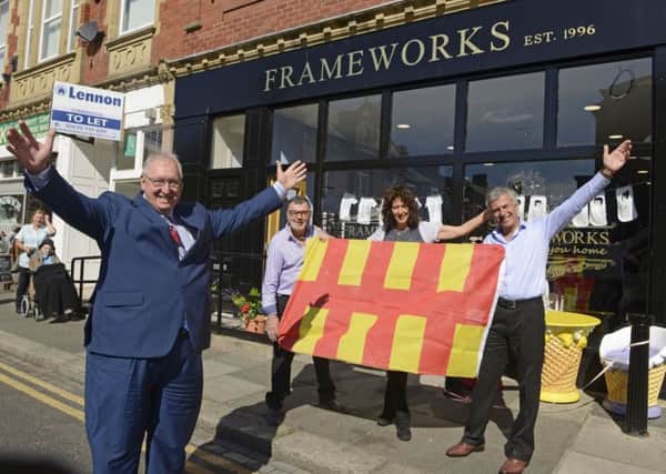 Grant Davey, county councillor for Kitty Brewster ward, and Peter and Angela Cosimini and John Wilson at the opening of the new Frameworks shop. Picture by Jane Coltman.
