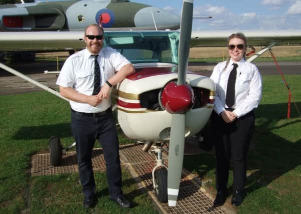 Esmee Webley is pictured alongside her aeroplane and CAA Flight Examiner, Captain Edward Burford.