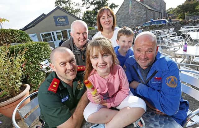 The Conway family thank the paramedic and coastguard officer who helped Anya.