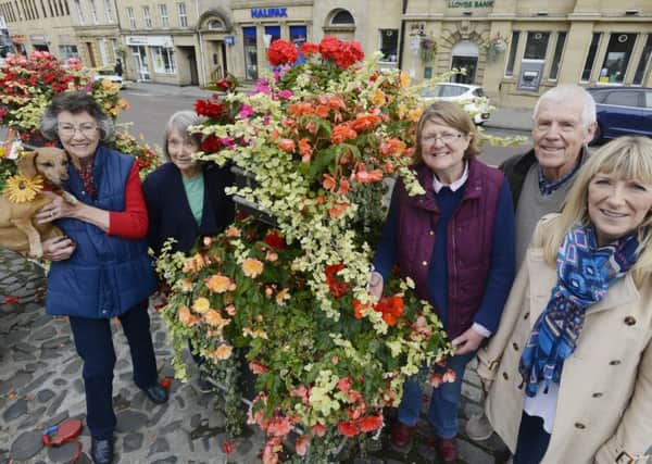Celebrating their success in Northumbria in Bloom are Daisy the Alnwick In Bloom mascot and her friends Gill Parker, Jenny MacDowell, Elizabeth Jones, Tom Pattinson and Margaret Casey. Picture by Jane Coltman