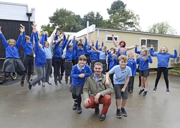 Jumping for joy - pupils show their delight at the new classroom at Hipsburn Primary School.
 Picture by Jane Coltman