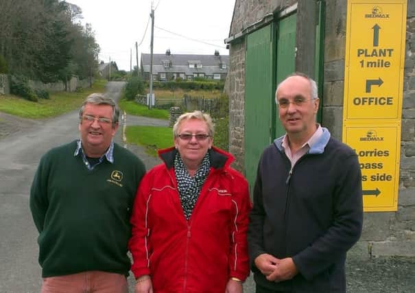 Robert Jackson, wife Brenda and Malcolm Stanton, from RODA (Residents of Detchant Association) on the road through Detchant near the Bedmax offices.