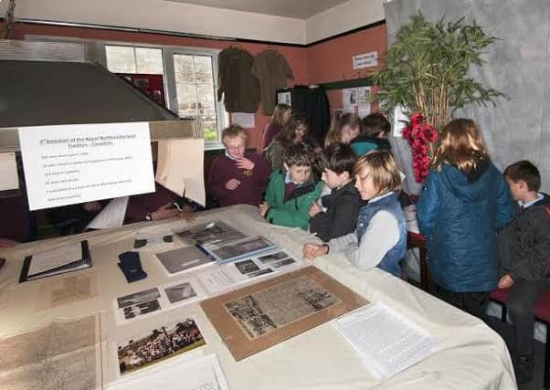 Schoolchildren visiting Belford Museum.