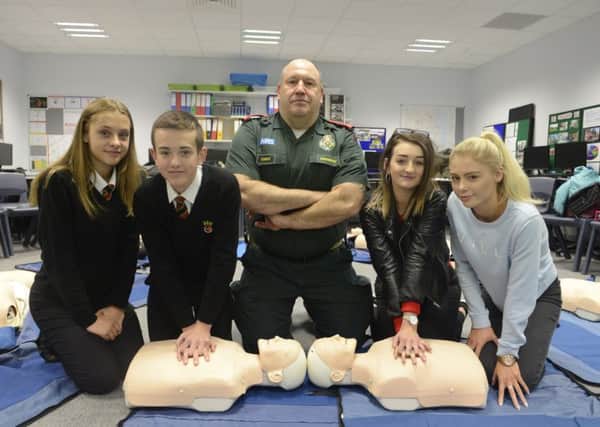 Christopher Hills, from the North East Ambulance Service, showed pupils from the Duchess's Community High School how to perform CPR. Picture by Jane Coltman