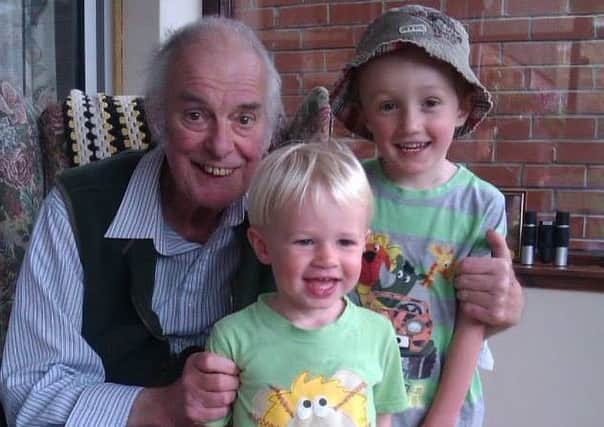 Les Jobson with his two grandchildren.
