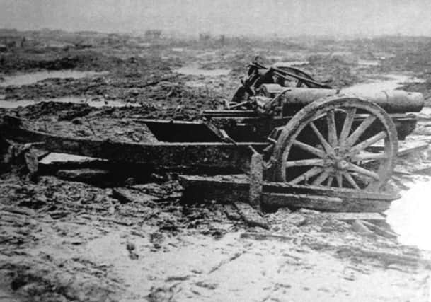 A six-inch Howitzer abandoned in a sea of mud.