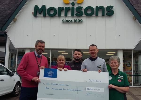 Staff from Morrisons, in Alnwick, with Stephen Carey's mother, Joy Bowman.