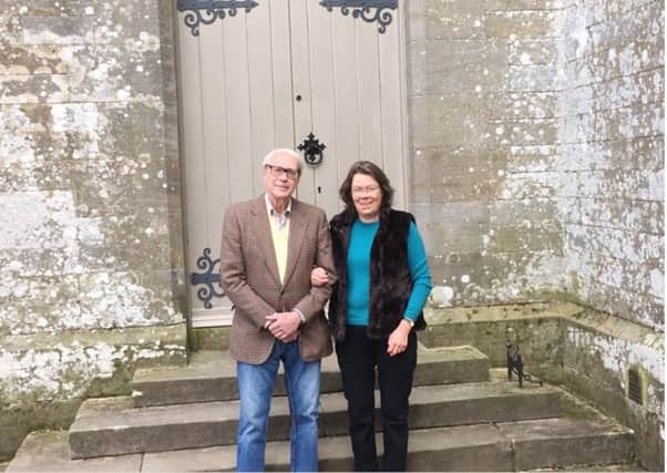 Anne and Bill Monroe, outside Greystead Old Church, formerly St Luke's, near Kielder.
