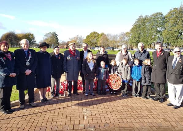 Children from The Dales School, in Blyth, with their hand-made wreath, local war veterans and members of Northumberland County Council.