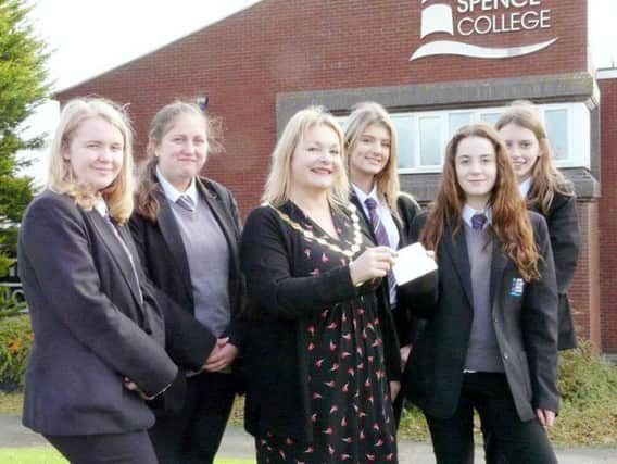 From left, Emma Turner, Lily Parks, Erin Dodds, Niamh Sheils and Emily Grimsy, fundraisers from the Interact Club of Coquet and Aln (Junior Branch of Amble and Warkworth Rotary), present the cheque to Amble Mayor Jane Dargue.