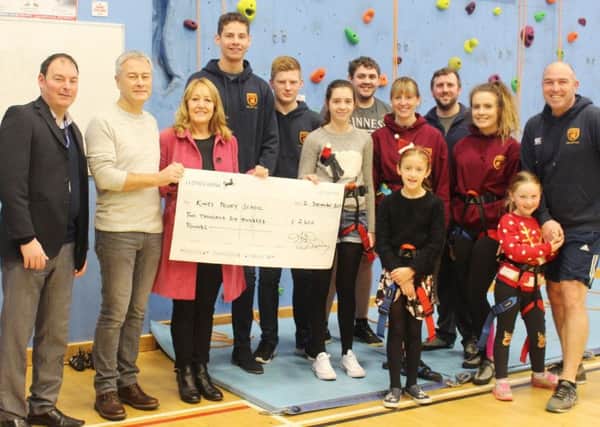 Left to right, principal Philip Sanderson, Hugh and Gill Dorey, Oliver Baksh, Matthew Walsh, Polly Allonby, Daniel Adamson, Amy Auld, Caitlin Collins (front), Ben Maddox, Jayne Guy, Martha Snow and Rob Snow.