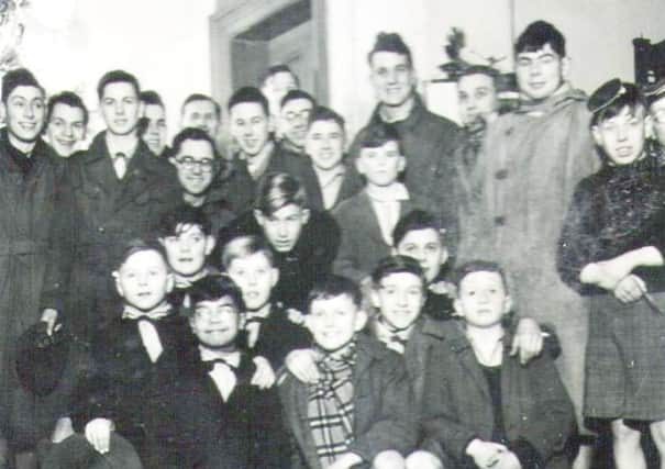 Christmas Eve, 1950, Barnardo boys with the Sixth Tynemouth Scouts singing carols in the hall of Beaconsfield House.