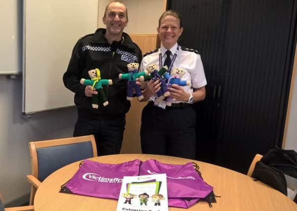 Sgt Mick Aspey and Ch Insp Clare Langley with some of the Trauma Teddies.