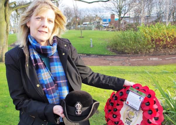 Gail Armstrong with Marjorie Skelseys hat and the wreath she laid at Blyth cenotaph.
