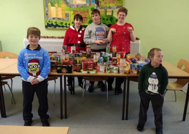 Barndale pupils with the collection for the food bank.