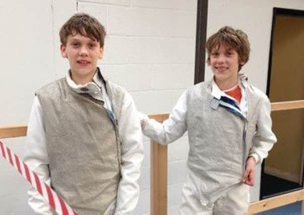 Young fencers, Hugh and Will Redmayne, now 15, pictured at a previous competition.