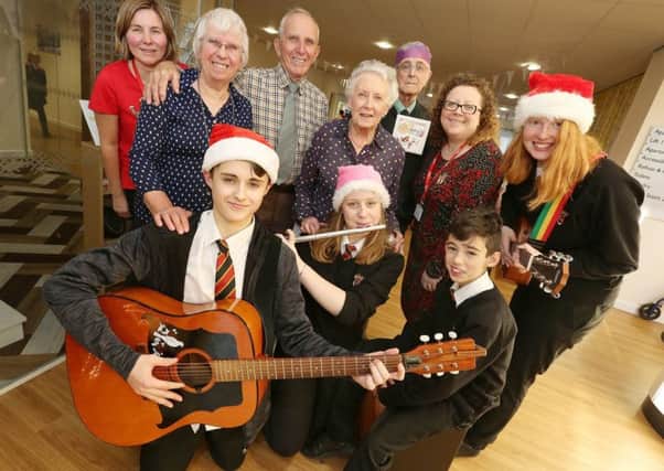 Pupils from The Duchesss Community High School join residents from Weavers Court Extra Care scheme in Alnwick to sing some Christmas songs during their annual Christmas meal.
