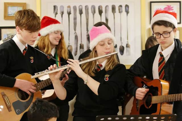 Pupils from The Duchesss Community High School play Christmas music for residents at Weavers Court Extra Care scheme in Alnwick.