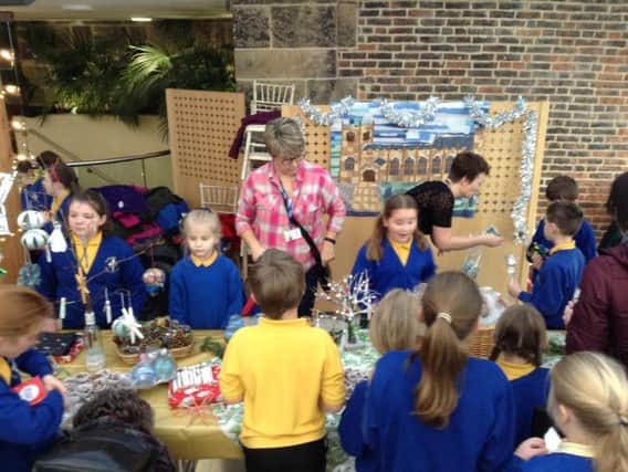 Busy bees - the St Michael's pupils on their stall at The Alnwick Garden.