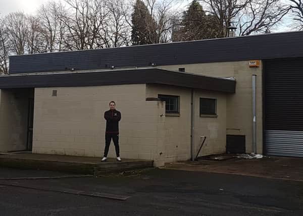 Olly Dial outside his new premises, which are currently being redeveloped.
