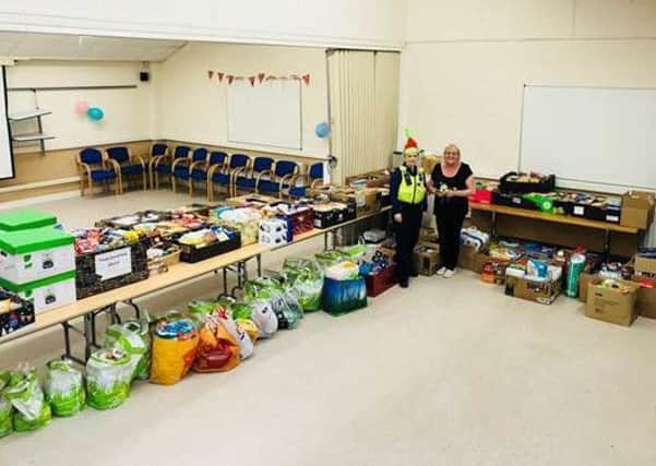 CSO Nicola Raisbeck with Jean Bell and many of the donations at the Briardale Community Centre in Blyth.