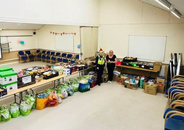 CSO Nicola Raisbeck with Jean Bell and many of the donations at the Briardale Community Centre in Blyth.