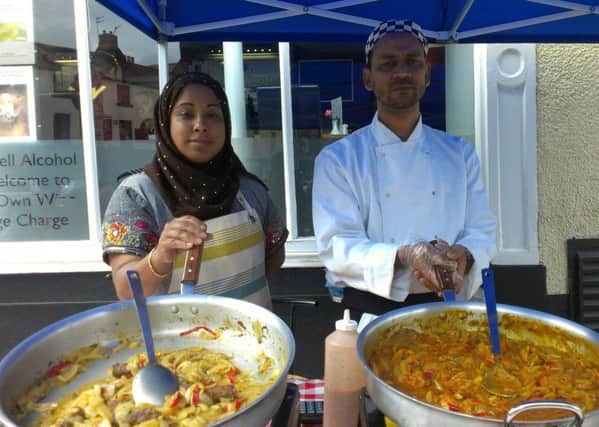 Amina Begum and Roy Uddin serving street food outside Mivesi restaurant.