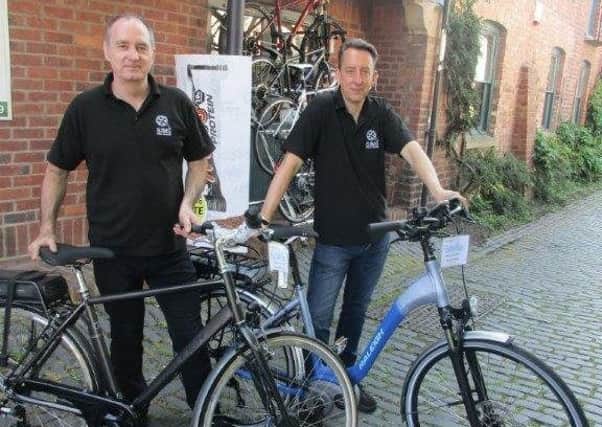 Ian Simpson, left, and Peter Bredael with some of the e-bikes.