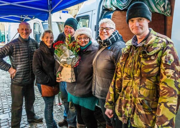 Billy Smith and Maggie Stephenson with Alnwick Markets manager Dawn Watts and other traders.