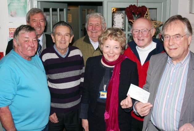 The Coach Inn Onion Club, Lesbury, members at the presentation of a Â£200 cheque to HospiceCare North Northumberland`s representative Jane Stratton. The money was raised from a raffle and auction of produce at their annual show at The Coach Inn, and the cheque was presented by Chairman John Aynsley to Jane Stratton.