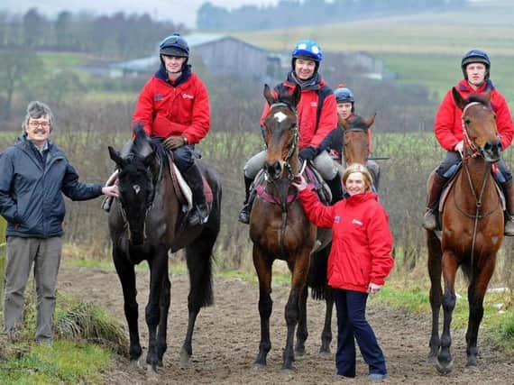 Terry Carroll and Susan Corbett, standing, with stable staff and Guy Opperman MP, centre. Picture by Jane Coltman