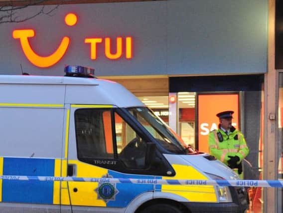 Police at the TUI branch in Southport on Saturday.