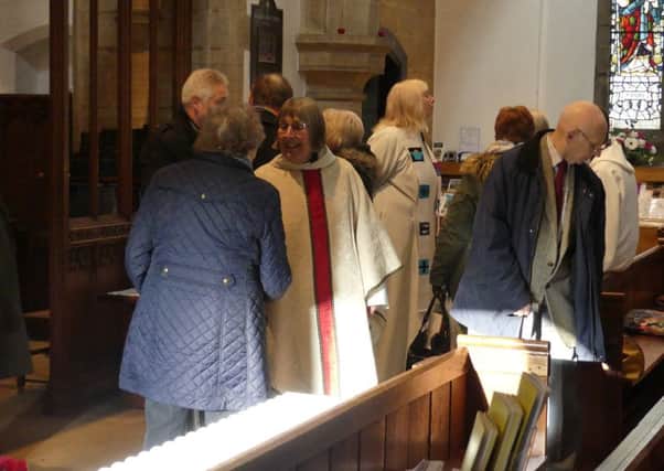 Rev Rosie Stacy says farewell to individual parishioners in Rothbury church. Picture by Jeff Reynalds
