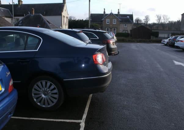 The effect of large cars in car parks marked out with standard bays is to make it difficult for people in adjacent bays. Picture by John Wylde.