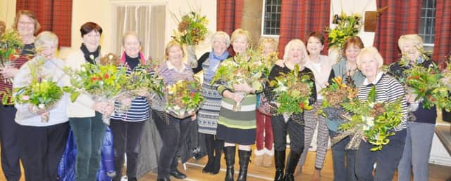 Alnmouth WI showing off their flower arranging skills