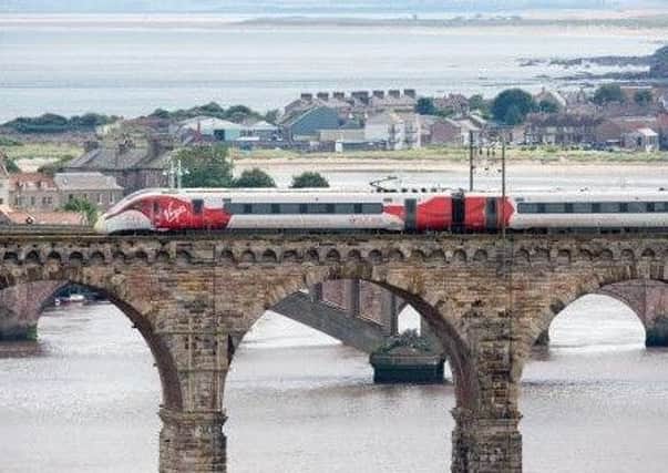 A Virgin train crosses the Royal Border Bridge at Berwick.