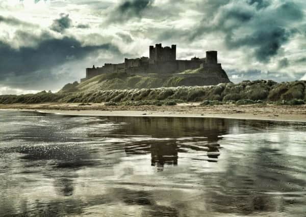 Bamburgh Castle and beach by Darren Chapman.