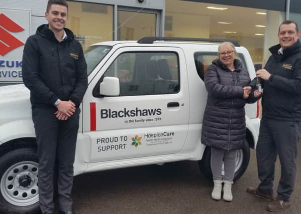 Blackshaws staff Ross Straughan and MJ Campbell with HospiceCare clinical manager Sue Gilbertson.